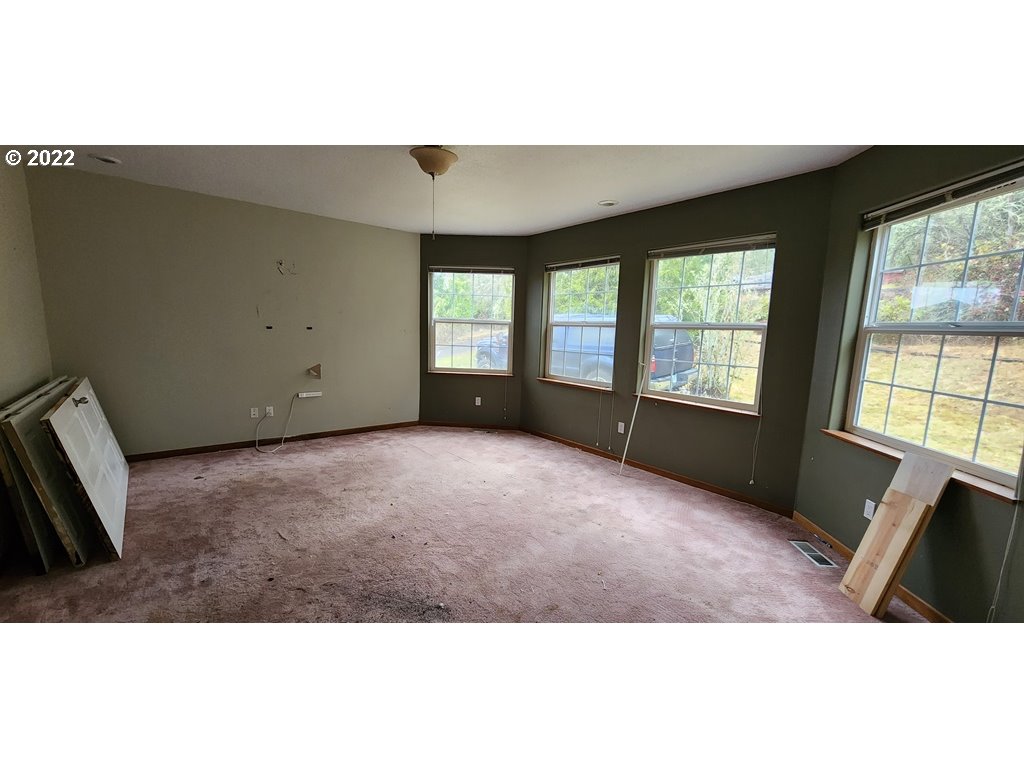 326 P G Sweet Road Kelso, WA 98626 - Photo 6 of 15 a view of an empty room with a window