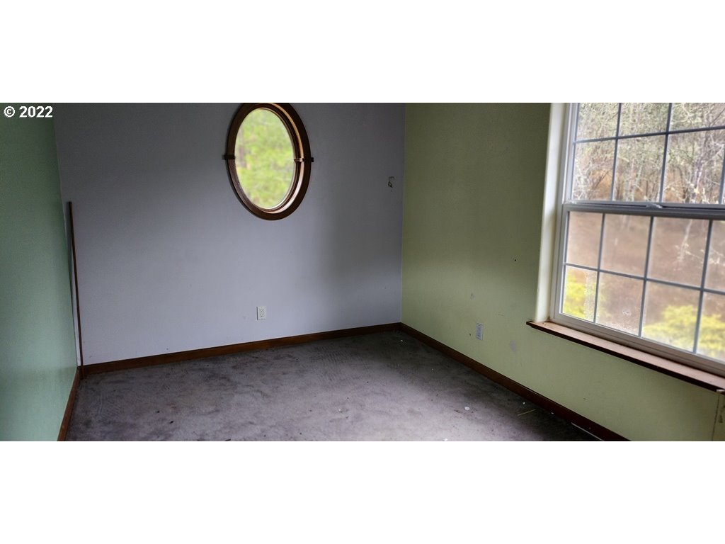 326 P G Sweet Road Kelso, WA 98626 - Photo 8 of 15 a view of a room with wooden floor and window