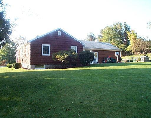 26 Williams Road New Fairfield, CT 06812 - Photo 1 of 1 a front view of a house with a garden