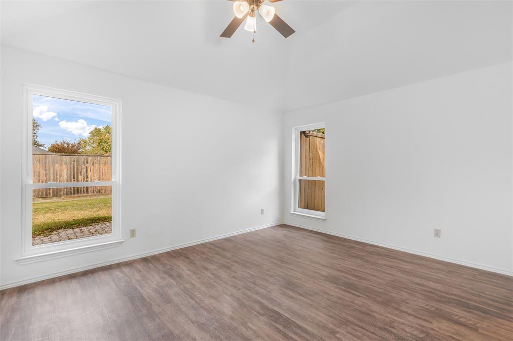 1313 Clover Drive Allen, TX 75002 - Photo 24 of 30 wooden floor in an empty room with a window