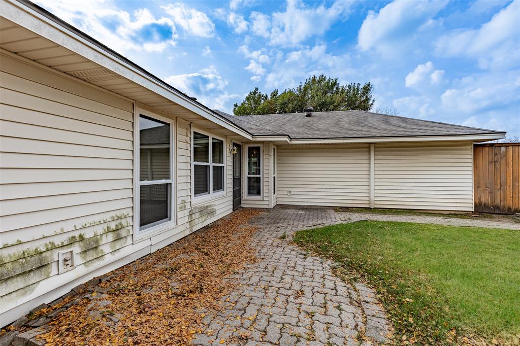 1313 Clover Drive Allen, TX 75002 - Photo 27 of 30 a front view of a house with garden
