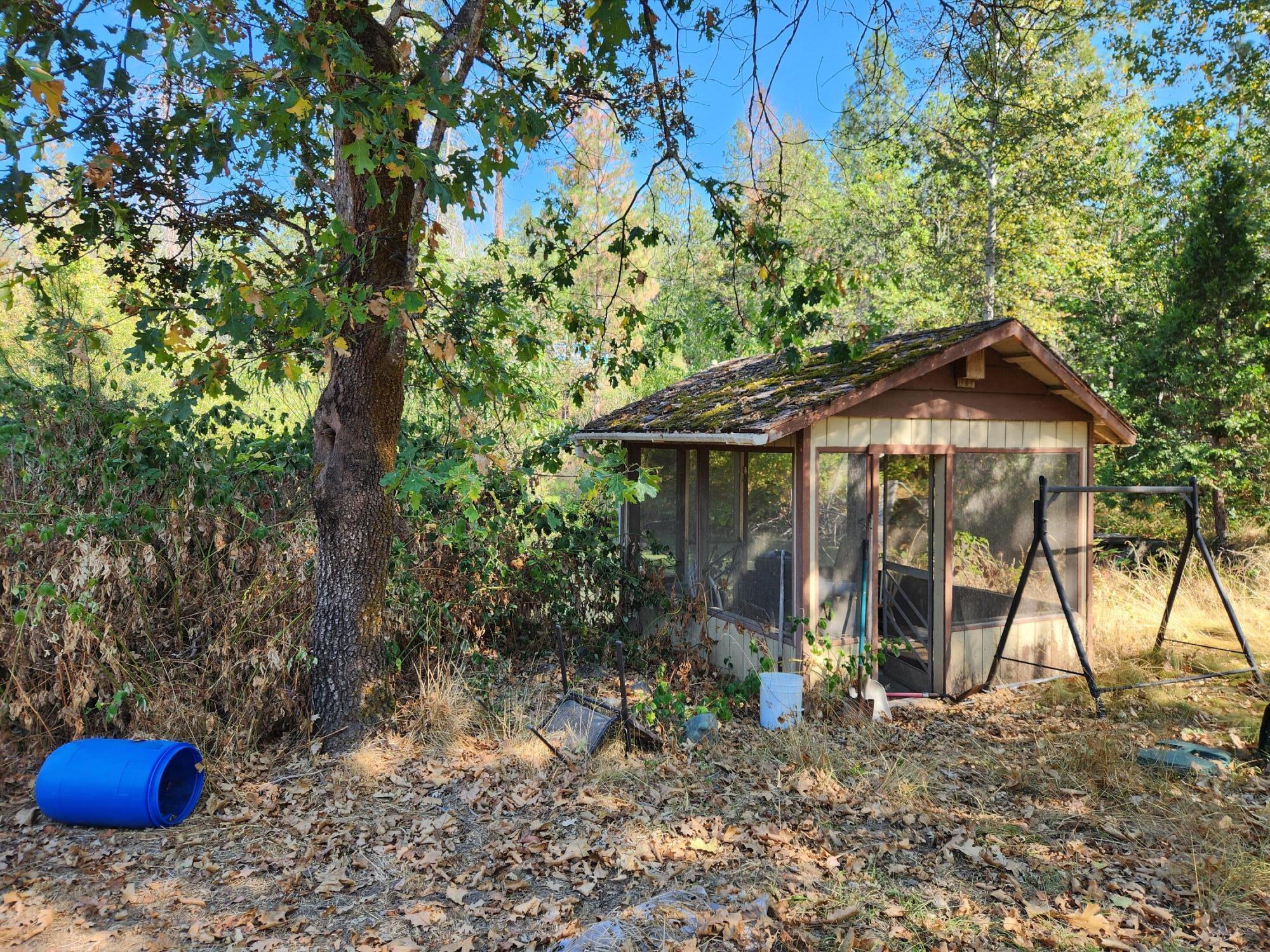 9290 Lower River Road Grants Pass, OR 97526 - Photo 12 of 21 Screened Pond sitting area
