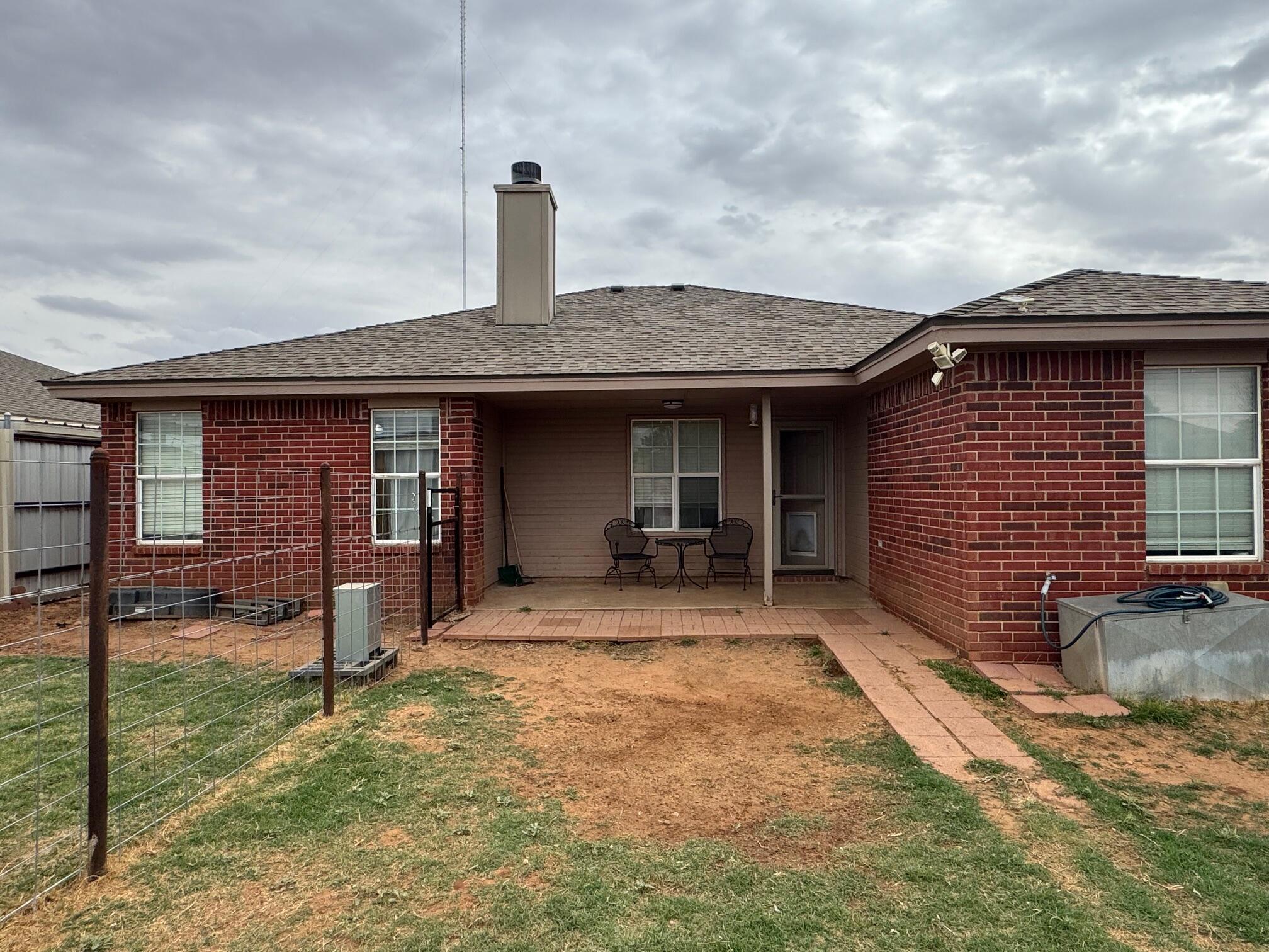 1906 81st Street Lubbock, TX 79423 - Photo 13 of 14 a front view of a house with garden
