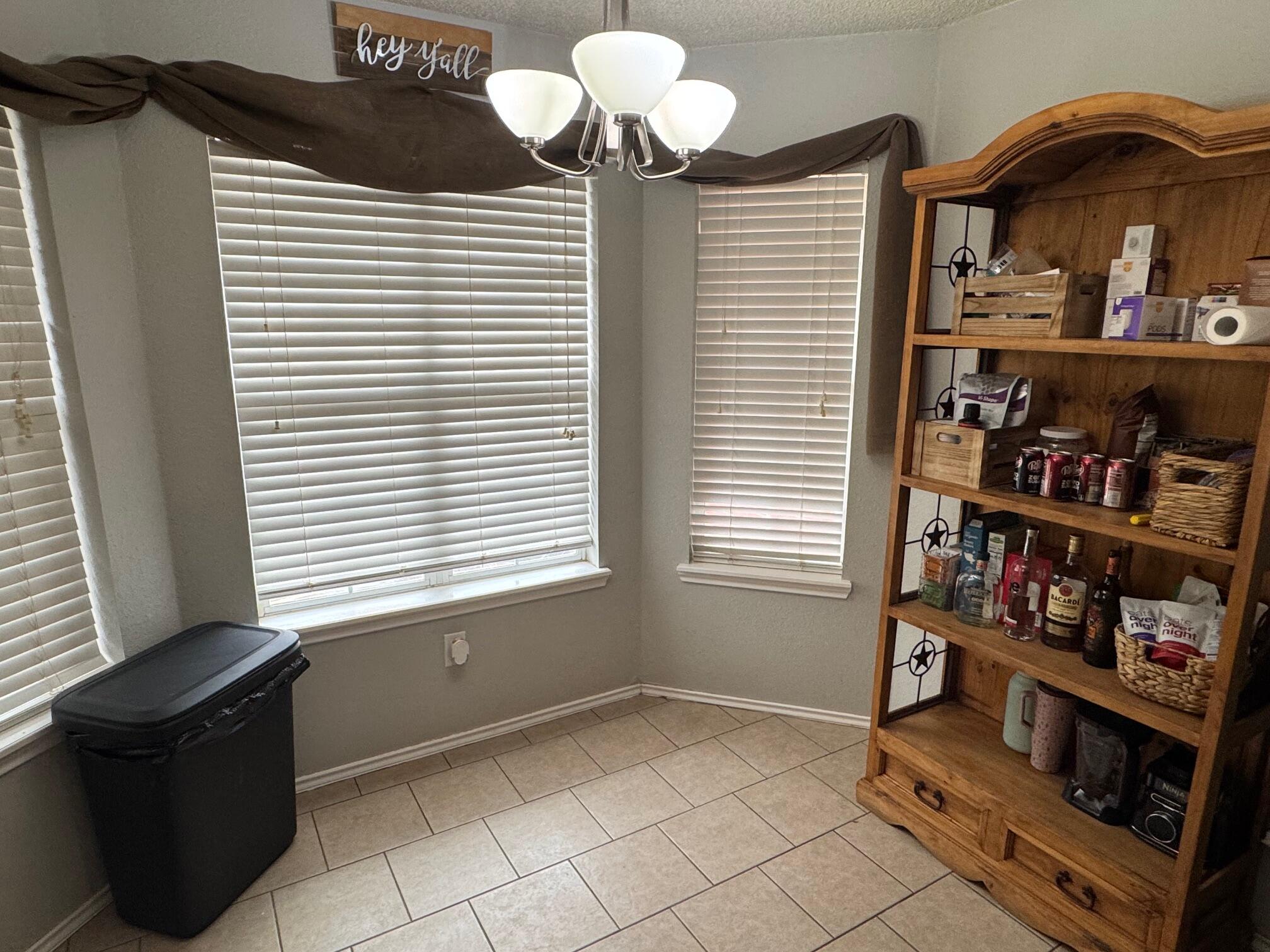 1906 81st Street Lubbock, TX 79423 - Photo 3 of 14 a view of a livingroom with shelves
