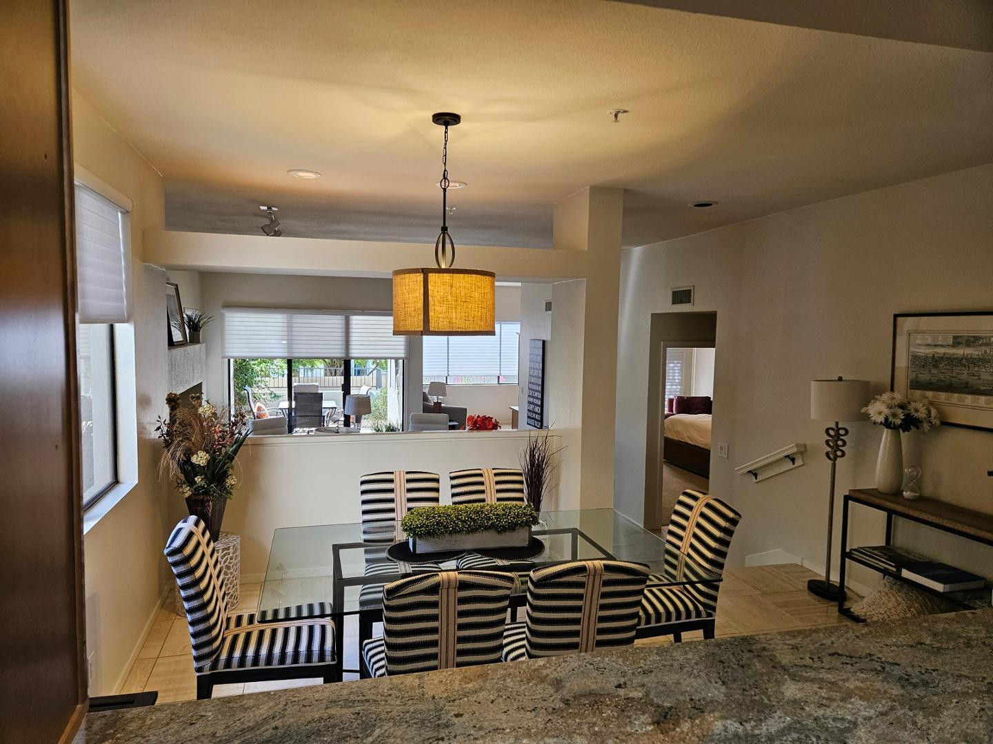 7700 East Gainey Ranch Road, Unit 153 Scottsdale, AZ 85258 - Photo 8 of 24 a kitchen with stainless steel appliances granite countertop a stove and a refrigerator