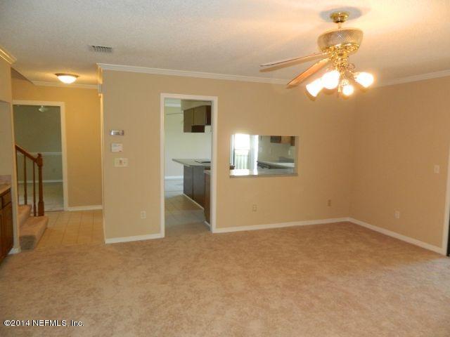 1649 Derringer Road Jacksonville, FL 32225 - Photo 14 of 50 a view of empty room with wooden floor