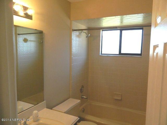 1649 Derringer Road Jacksonville, FL 32225 - Photo 42 of 50 a bathroom with a toilet and shower