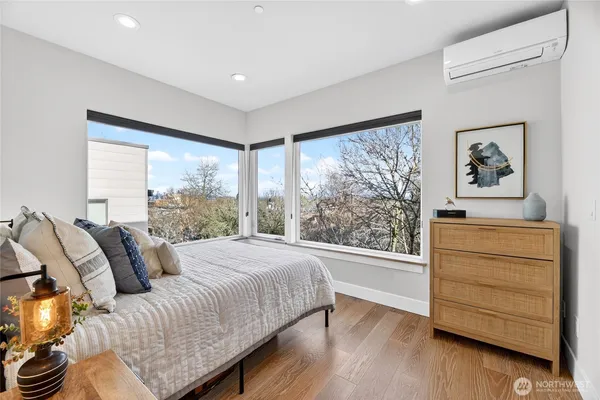 a bedroom with a bed and a dresser
