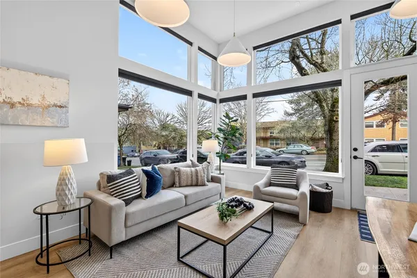 a living room with furniture and a large window
