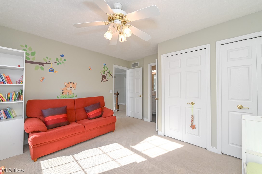 1688 Sheridan Road South Euclid, OH 44121 - Photo 25 of 48 Carpeted living room featuring ceiling fan