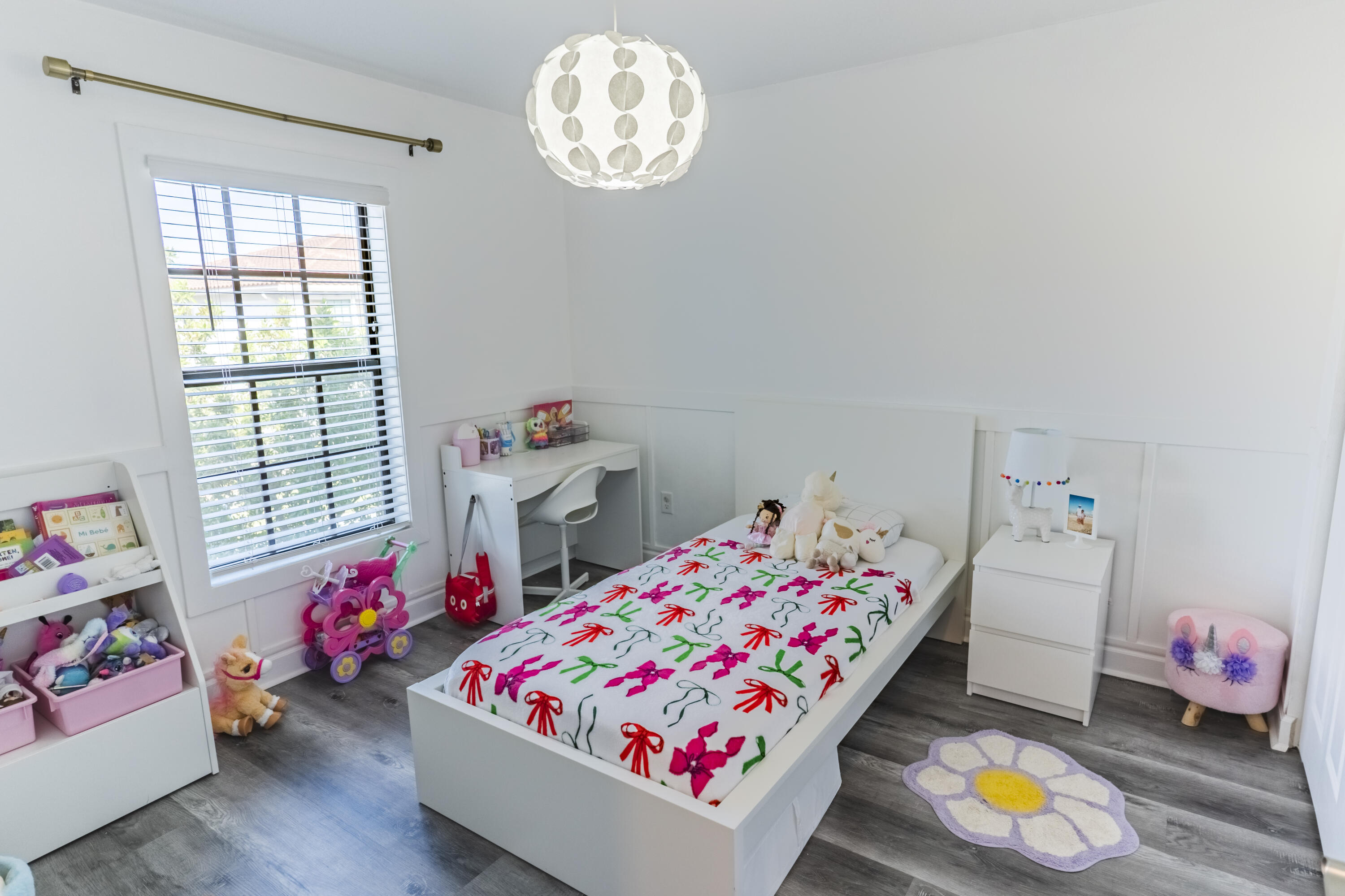 2025 Sugar Maple Drive Riviera Beach, FL 33410 - Photo 13 of 23 a bedroom with toys and a window