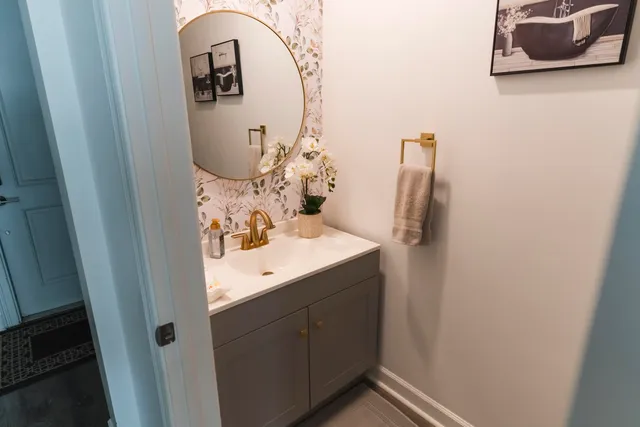 a bathroom with a sink and mirror