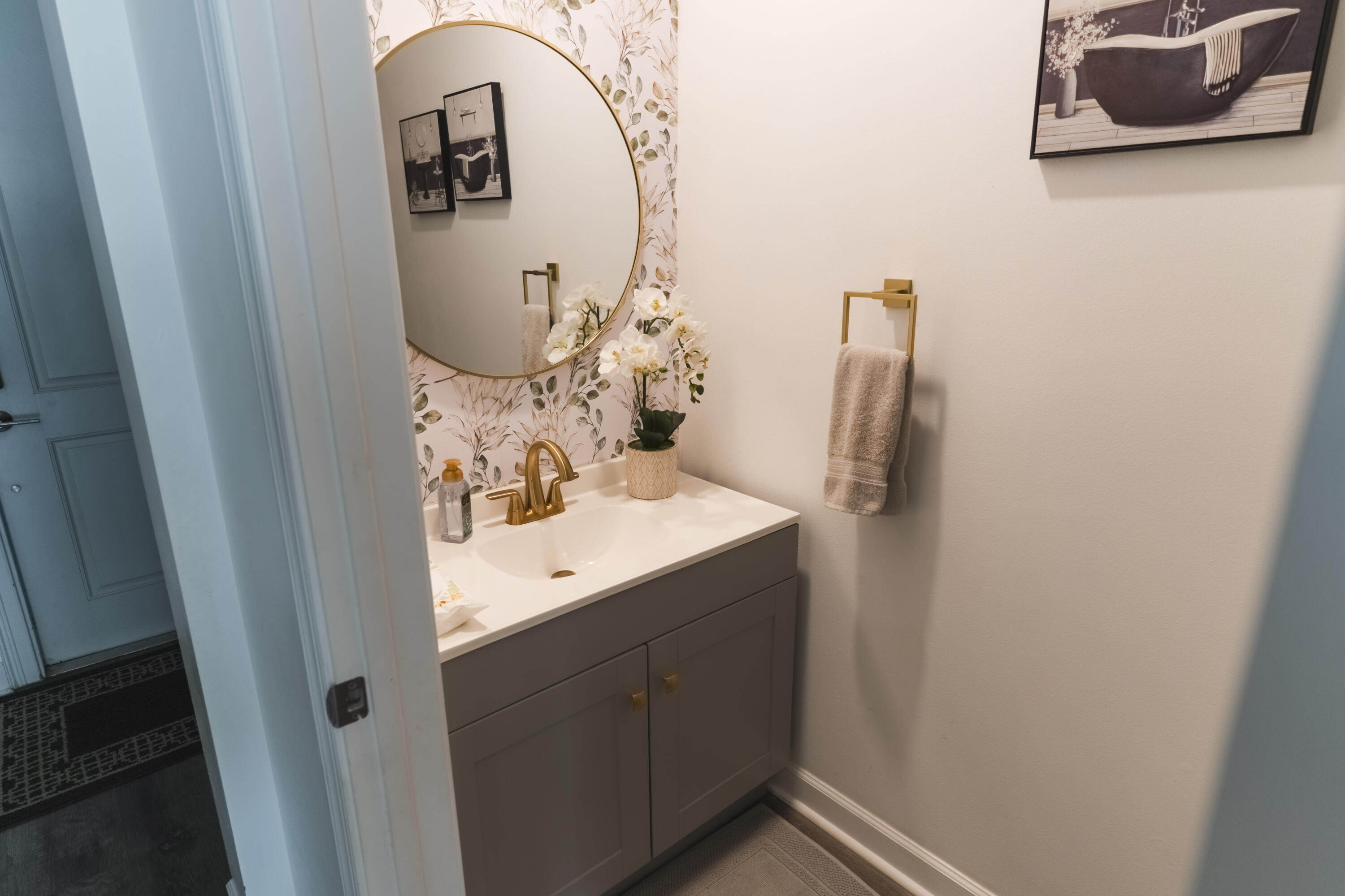 2025 Sugar Maple Drive Riviera Beach, FL 33410 - Photo 15 of 23 a bathroom with a sink and mirror