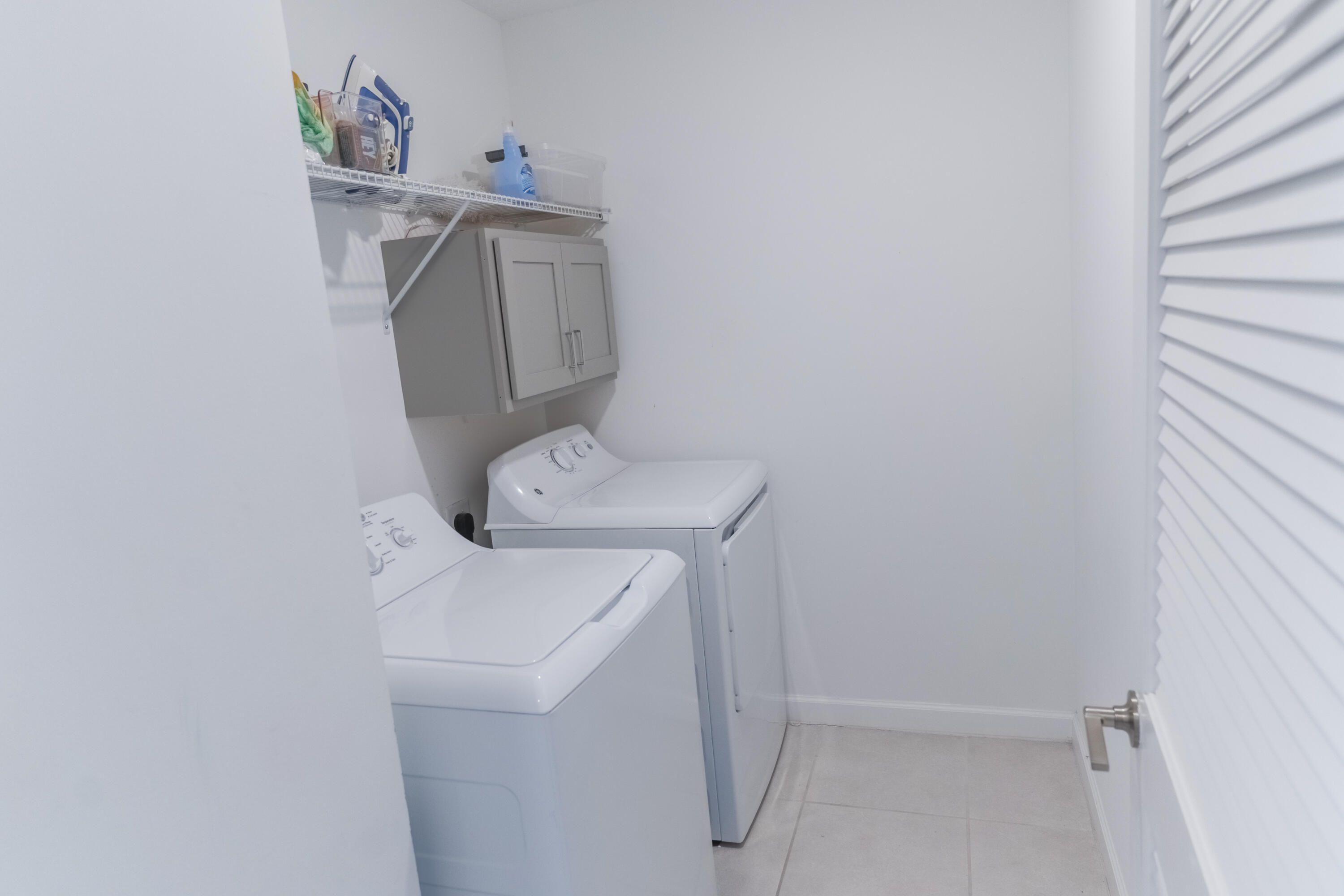 2025 Sugar Maple Drive Riviera Beach, FL 33410 - Photo 16 of 23 a utility room with dryer and washer