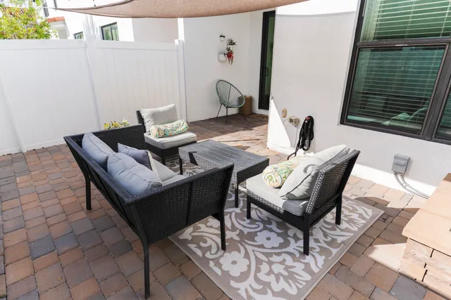 a dining room with furniture and wooden floor