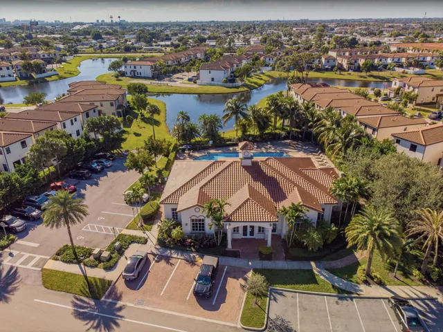 an aerial view of residential houses with outdoor space