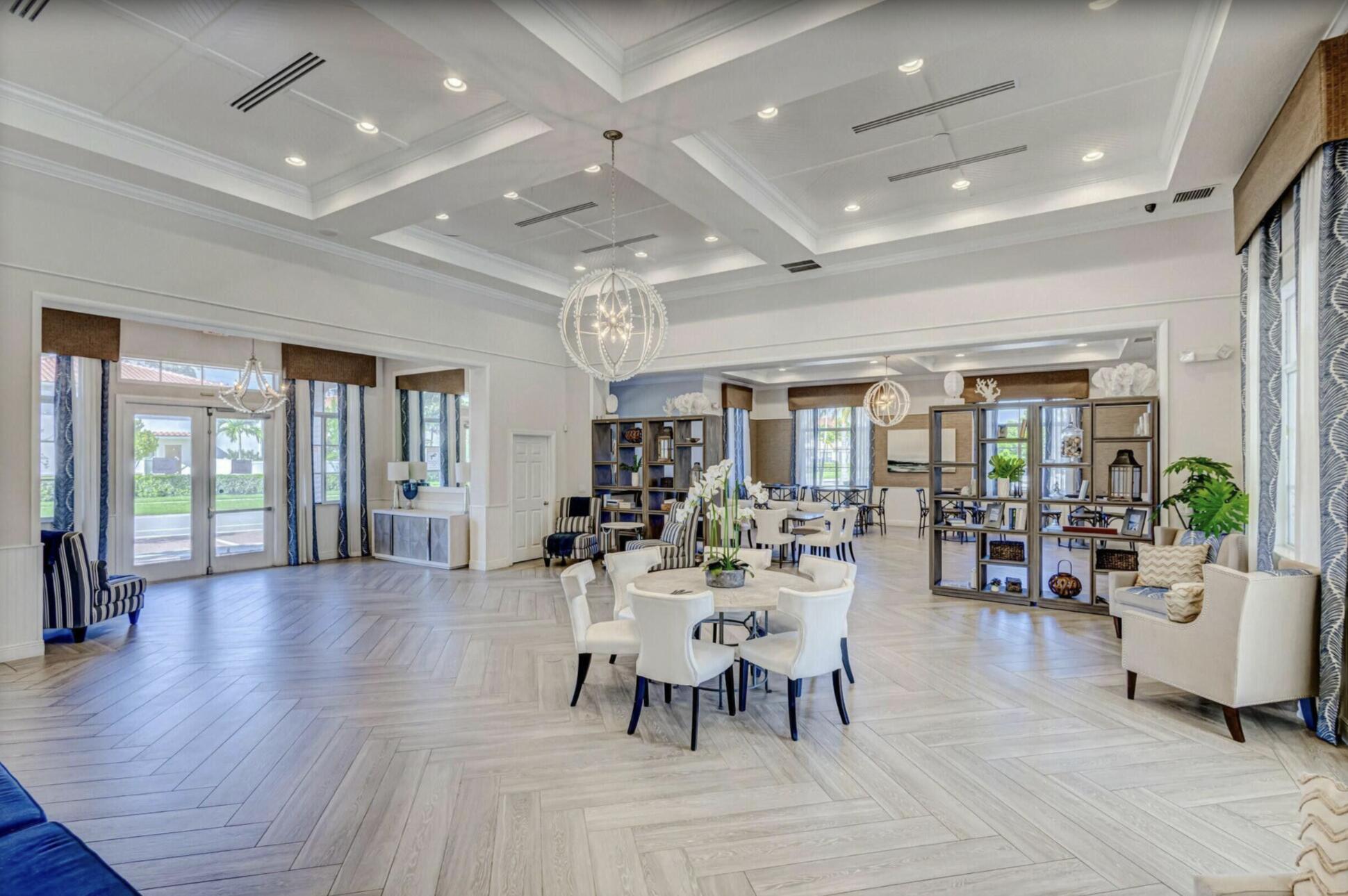 2025 Sugar Maple Drive Riviera Beach, FL 33410 - Photo 20 of 23 a view of a dining room with furniture window and wooden floor