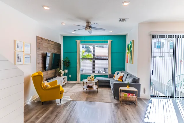 a living room with furniture and a large window