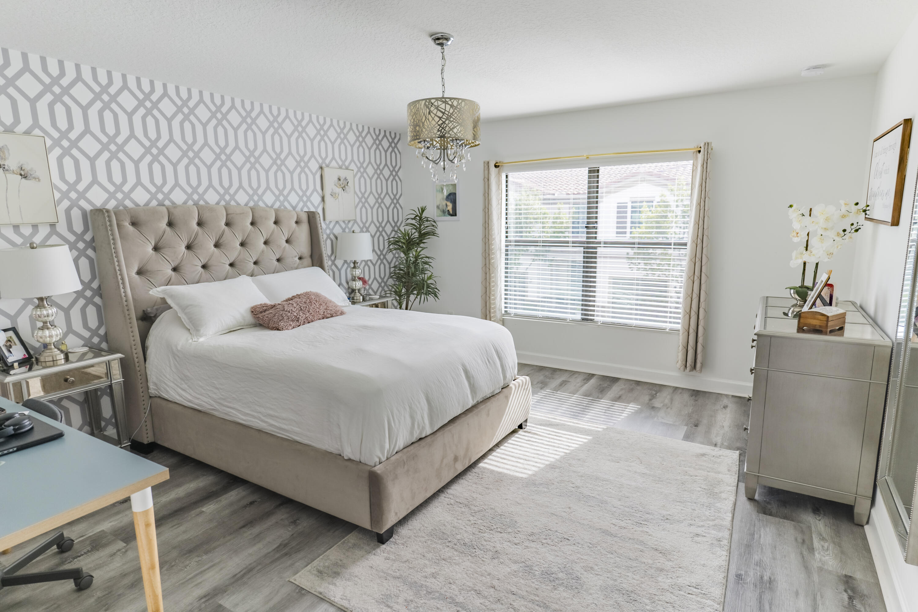 2025 Sugar Maple Drive Riviera Beach, FL 33410 - Photo 9 of 23 a bedroom with a large bed and a window