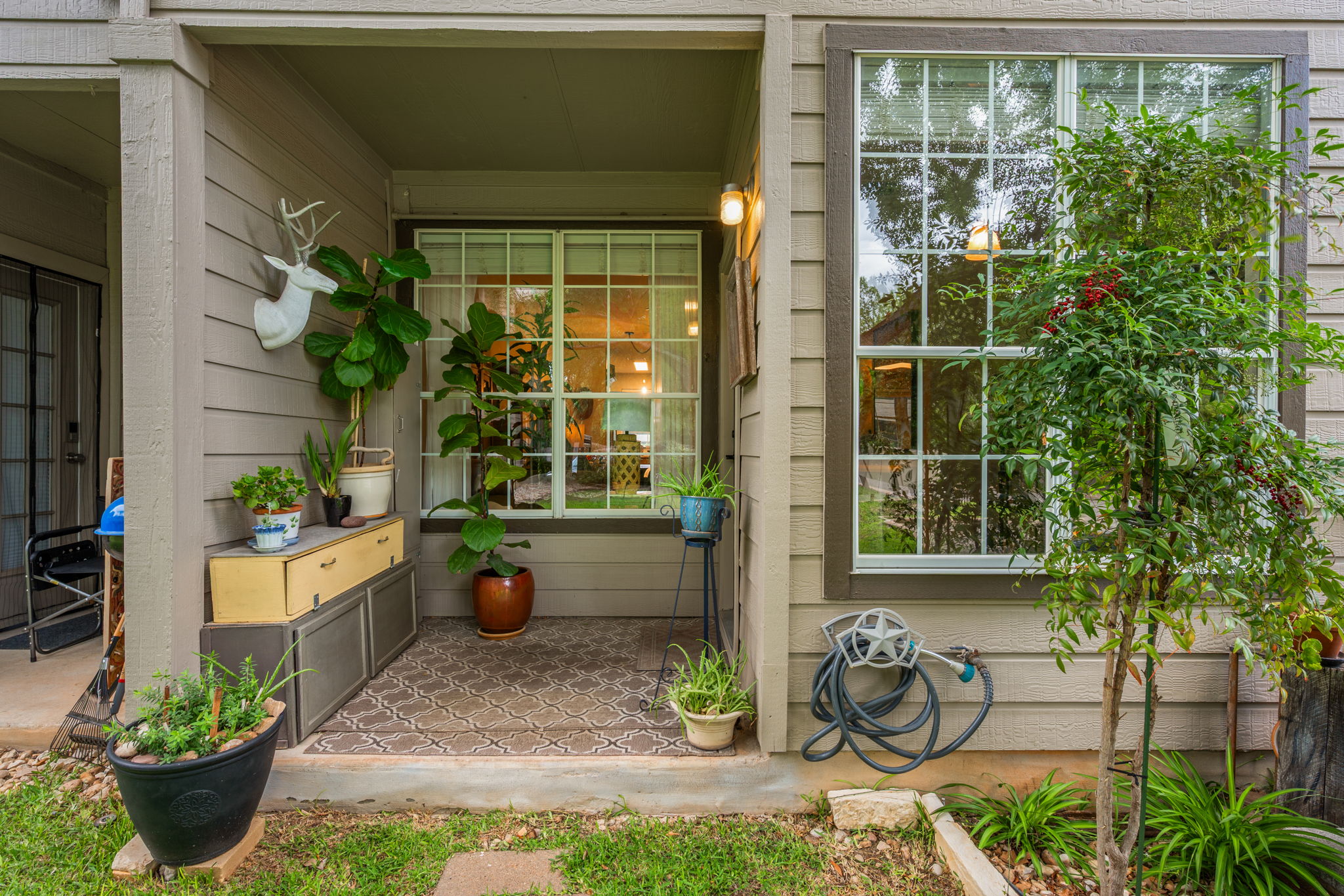 12401 Los Indios Trail, Unit 32 Austin, TX 78729 - Photo 26 of 39 Back porch opens to green space and extra parking