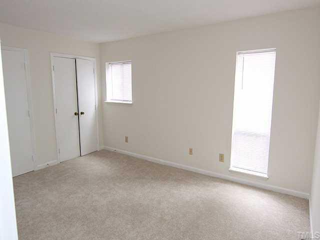 552 Pine Ridge Place Raleigh, NC 27609 - Photo 6 of 12 Large master bedroom with new carpet and newly painted walls. Great closet space in this room.