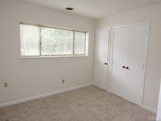 552 Pine Ridge Place Raleigh, NC 27609 - Photo 8 of 12 2nd Bedroom is also spacious. New carpet, Newly painted walls, closets painted, great closet space.