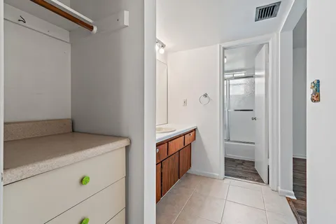 a bathroom with a sink double vanity and a mirror