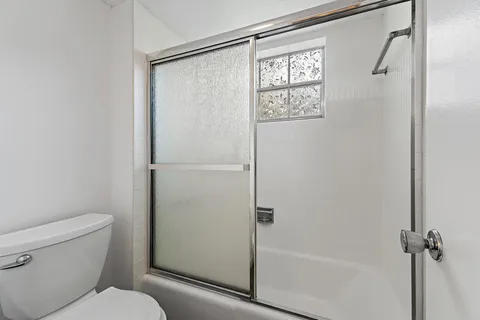 a view of an entryway with a floor to ceiling window
