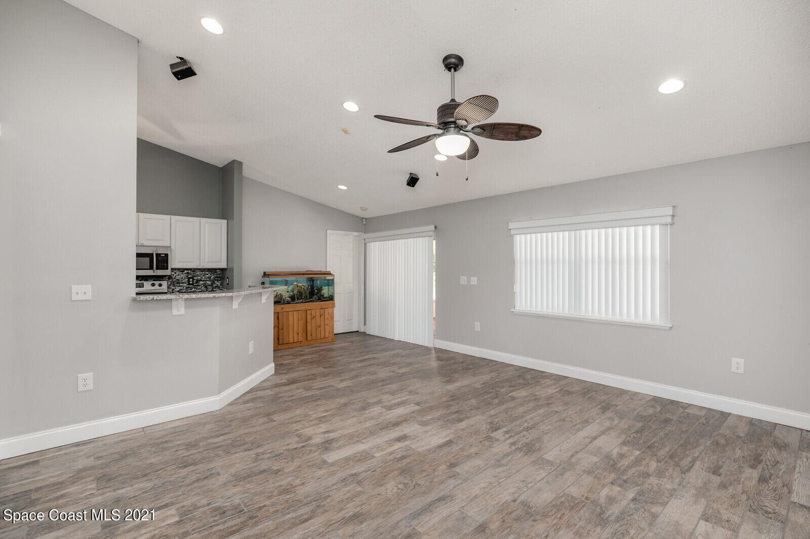 335 Gordon Road Northwest Palm Bay, FL 32907 - Photo 13 of 58 a view of a kitchen with a sink stainless steel appliances and cabinets