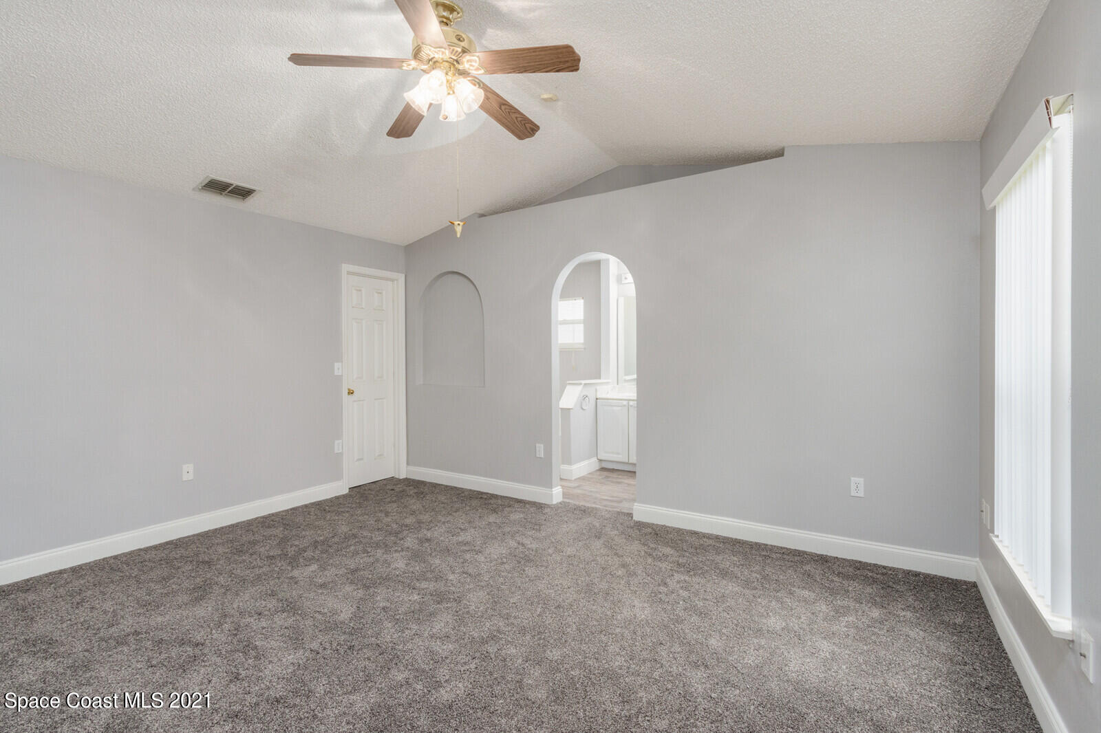 335 Gordon Road Northwest Palm Bay, FL 32907 - Photo 21 of 58 a view of empty room with ceiling fan