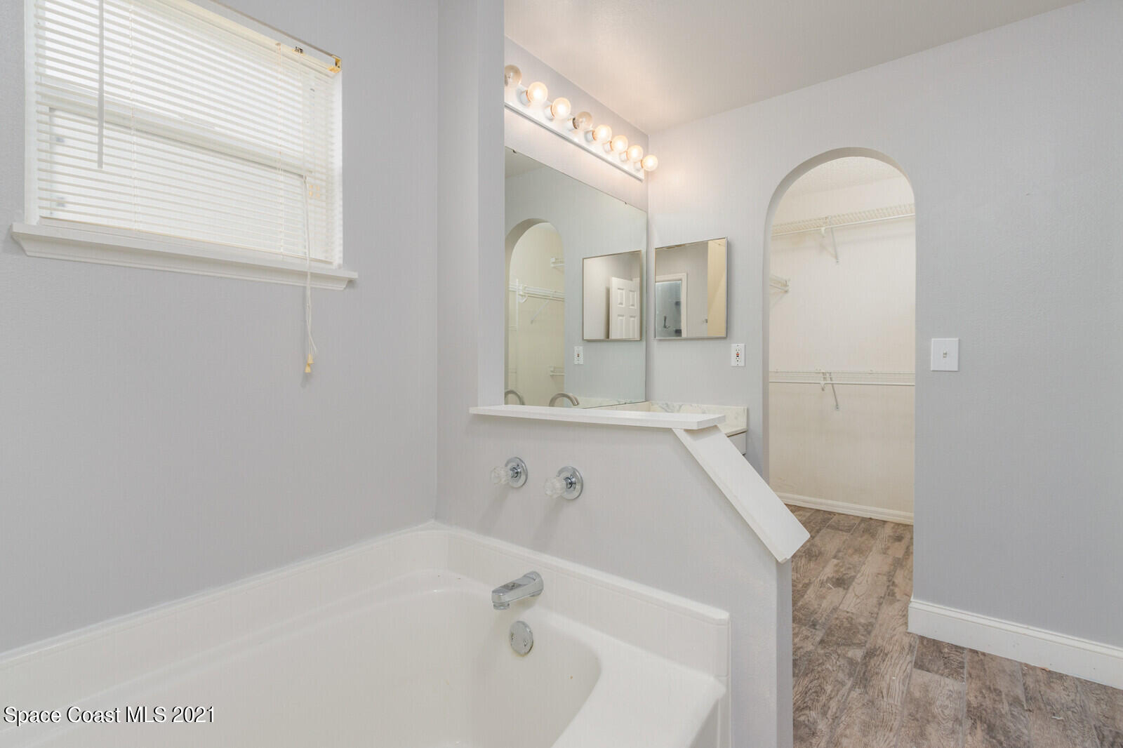 335 Gordon Road Northwest Palm Bay, FL 32907 - Photo 25 of 58 a bathroom with a bathtub and a sink