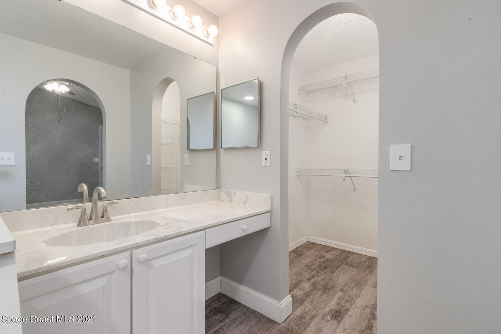 335 Gordon Road Northwest Palm Bay, FL 32907 - Photo 26 of 58 a bathroom with a sink and a mirror
