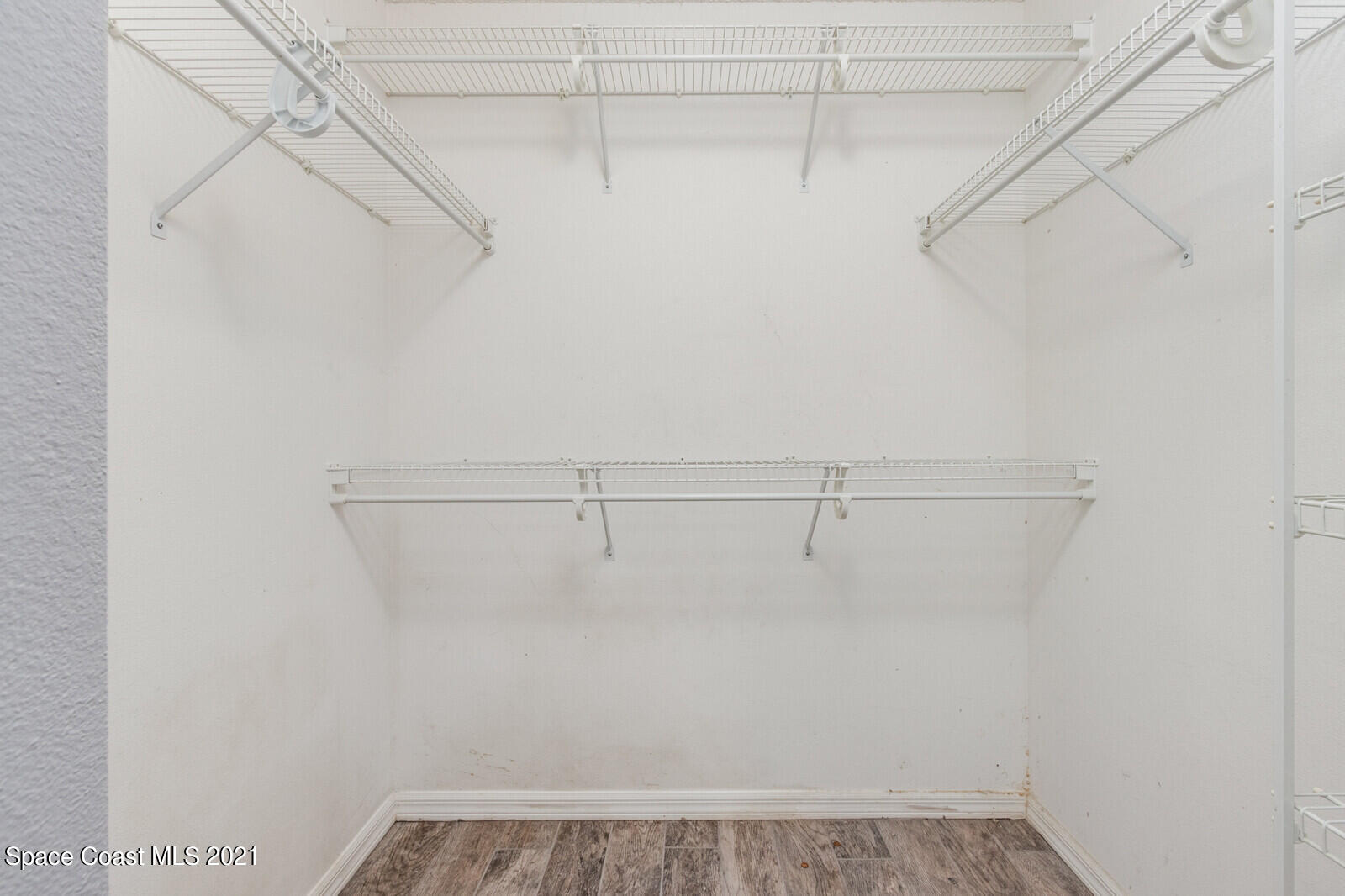 335 Gordon Road Northwest Palm Bay, FL 32907 - Photo 28 of 58 a view of a room with racks on the wall