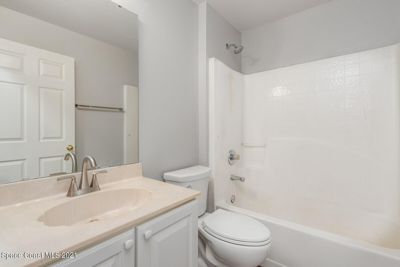 335 Gordon Road Northwest Palm Bay, FL 32907 - Photo 33 of 58 a bathroom with a sink toilet vanity and shower