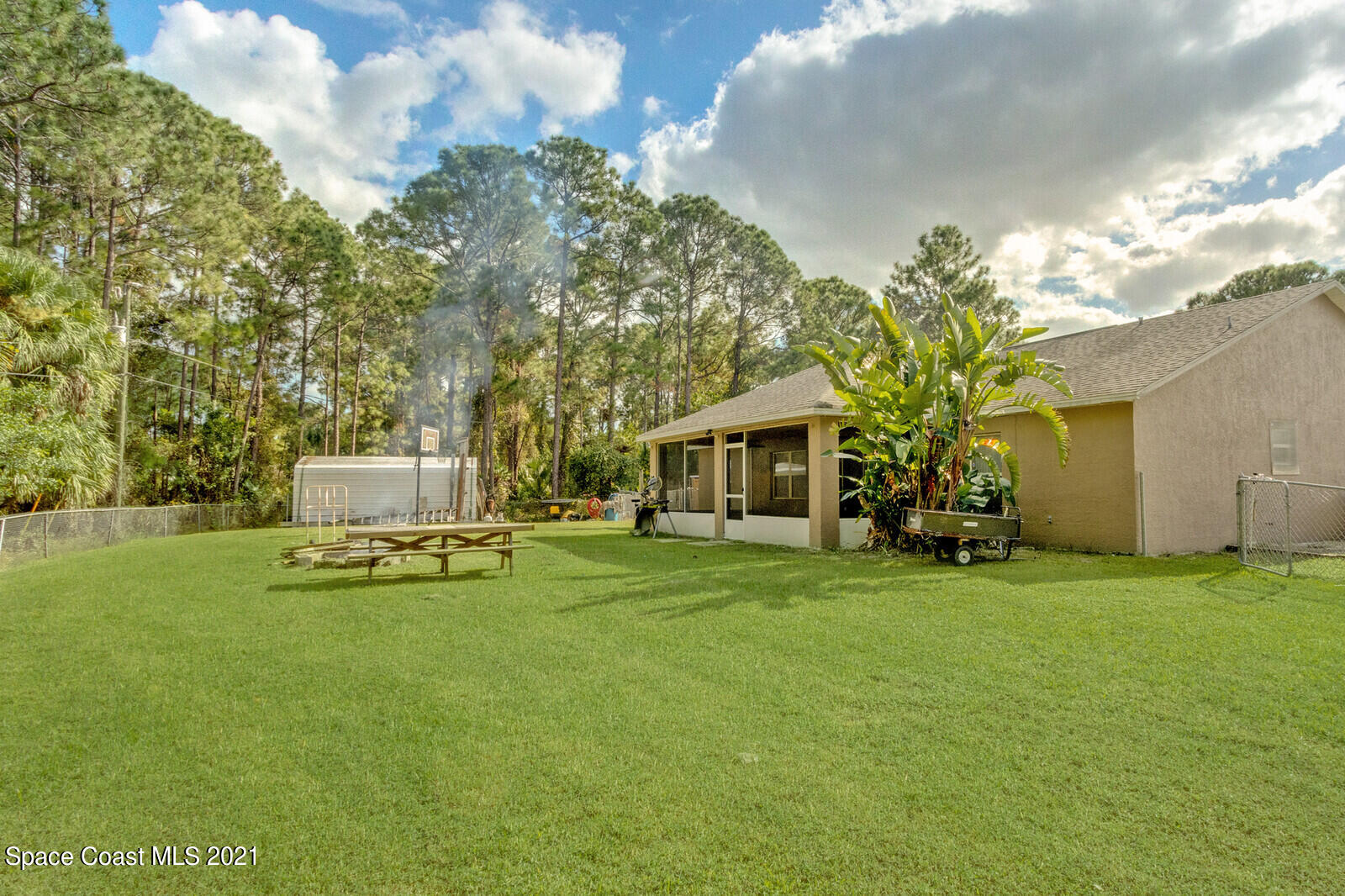 335 Gordon Road Northwest Palm Bay, FL 32907 - Photo 34 of 58 a front view of a house with garden