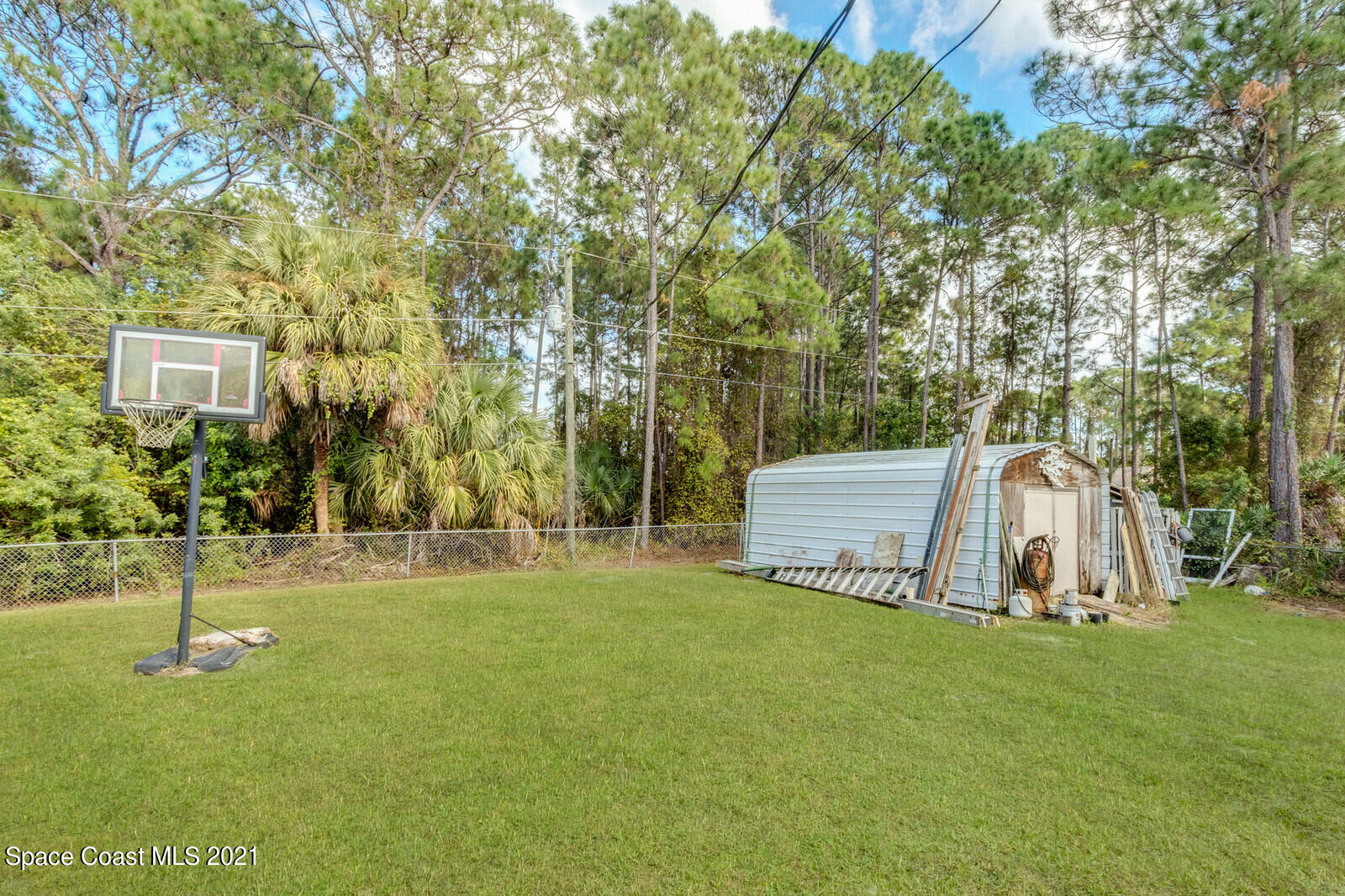 335 Gordon Road Northwest Palm Bay, FL 32907 - Photo 37 of 58 Back view & Shed