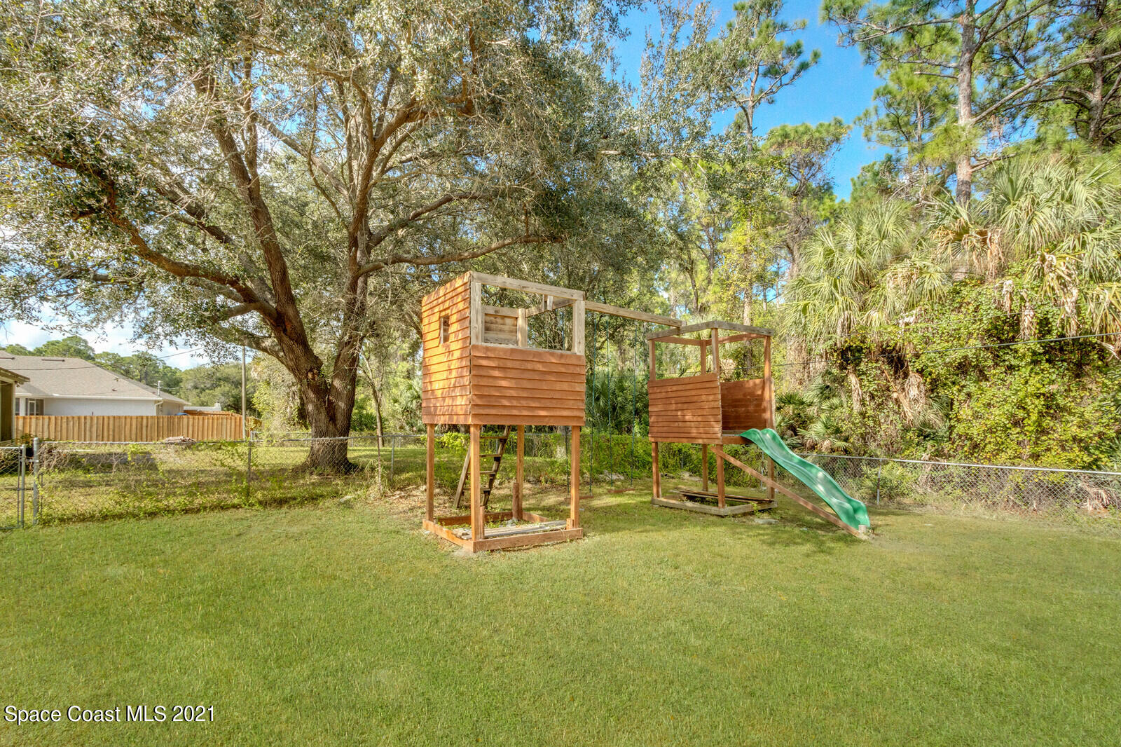 335 Gordon Road Northwest Palm Bay, FL 32907 - Photo 38 of 58 a view of outdoor space with playground and green space