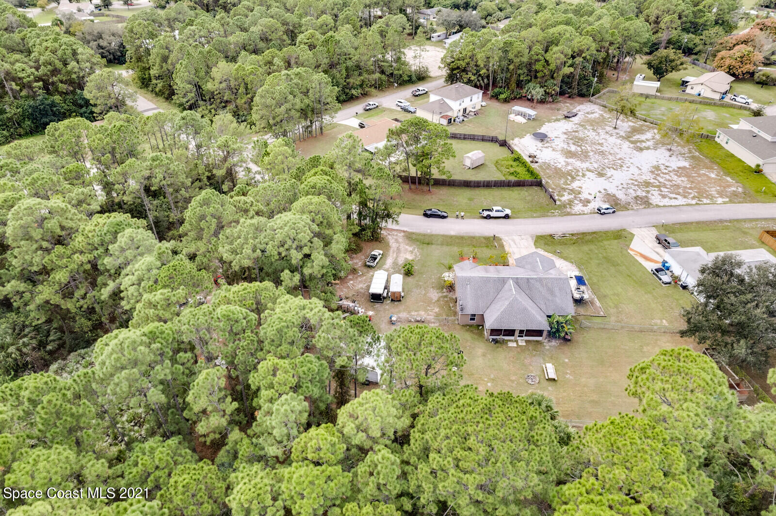 335 Gordon Road Northwest Palm Bay, FL 32907 - Photo 43 of 58 an aerial view of a house with a yard and lake view