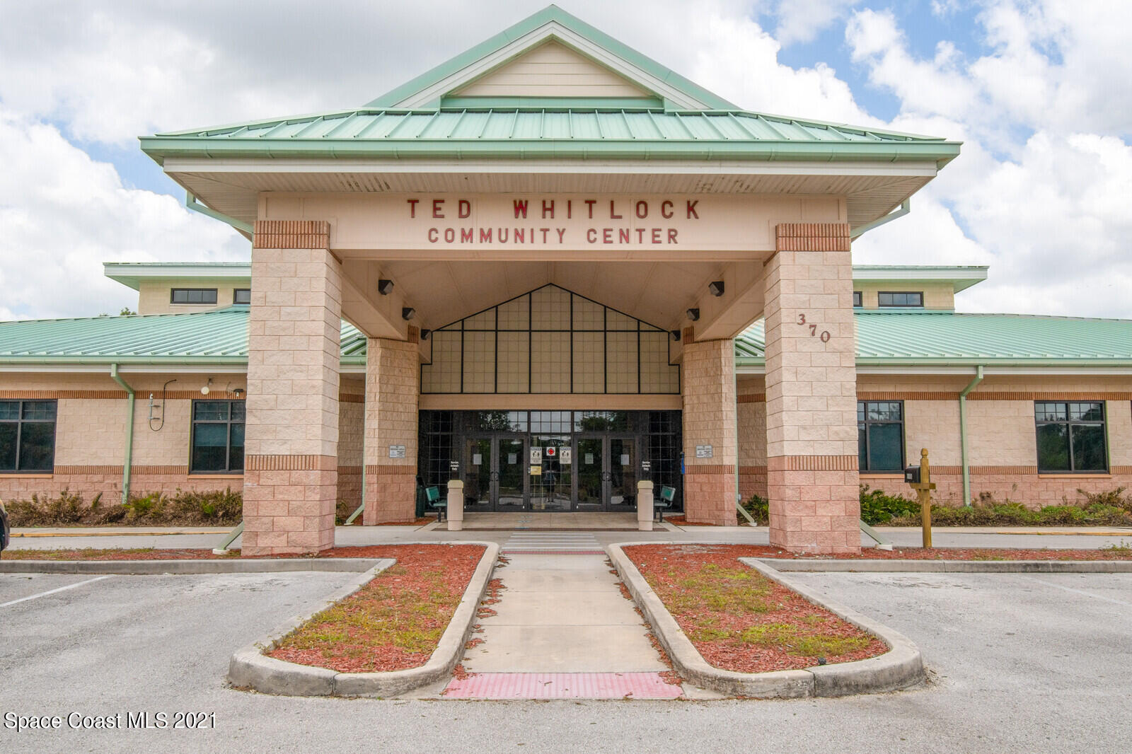 335 Gordon Road Northwest Palm Bay, FL 32907 - Photo 47 of 58 a view of a building with a outdoor space