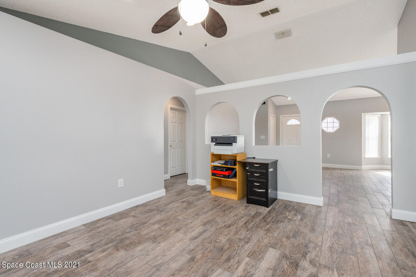335 Gordon Road Northwest Palm Bay, FL 32907 - Photo 10 of 58 a view of a livingroom with wooden floor