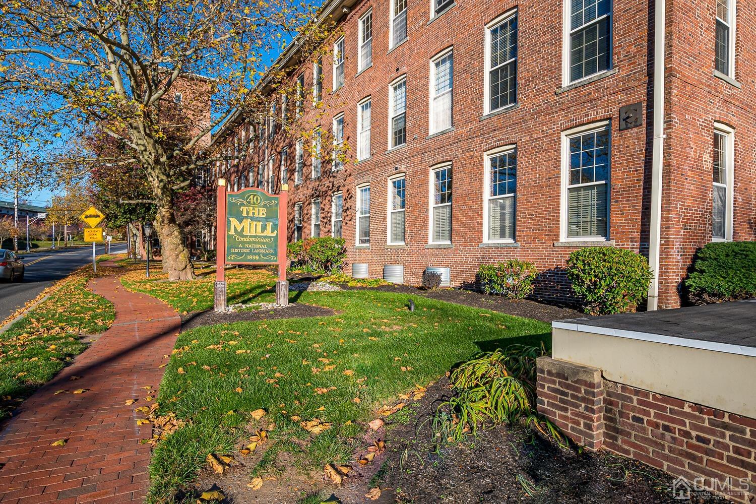 a front view of a building with garden