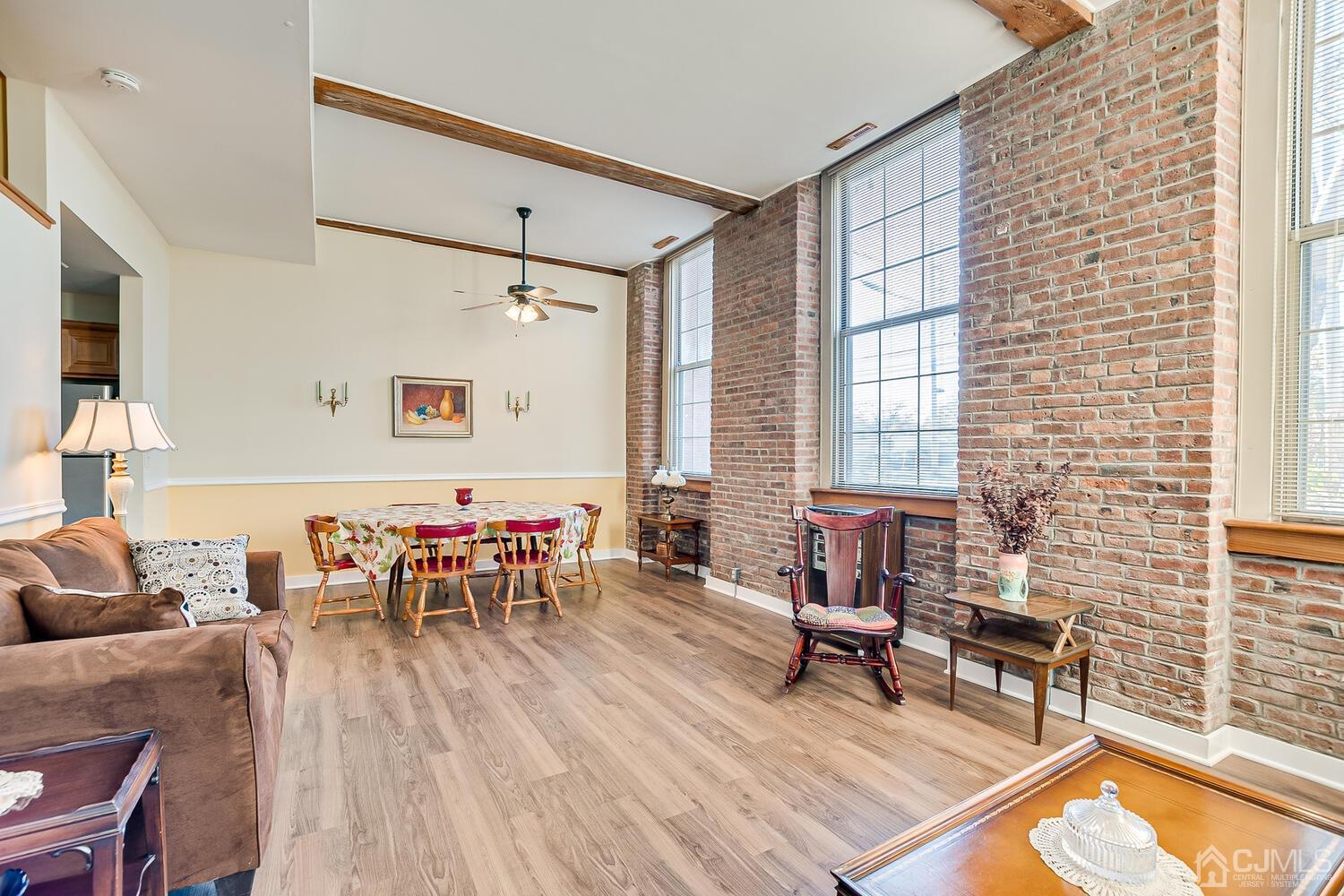 40 Washington Avenue, Unit 9 Milltown, NJ 08850 - Photo 16 of 43 a living room with furniture and a wooden floor