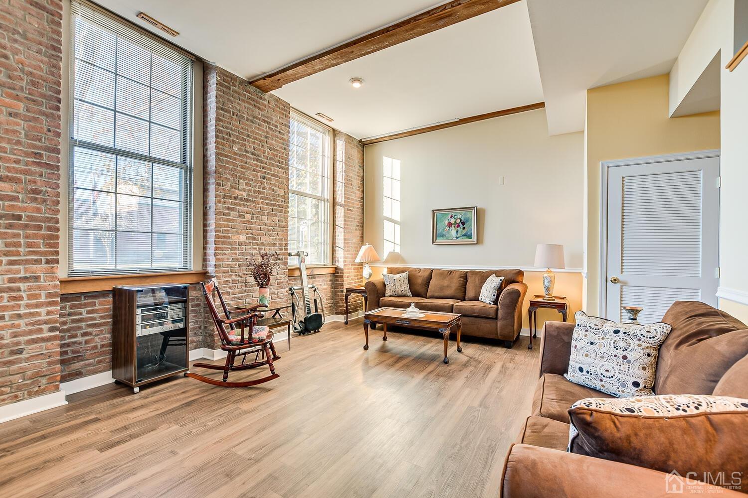 40 Washington Avenue, Unit 9 Milltown, NJ 08850 - Photo 19 of 43 a living room with furniture and a large window