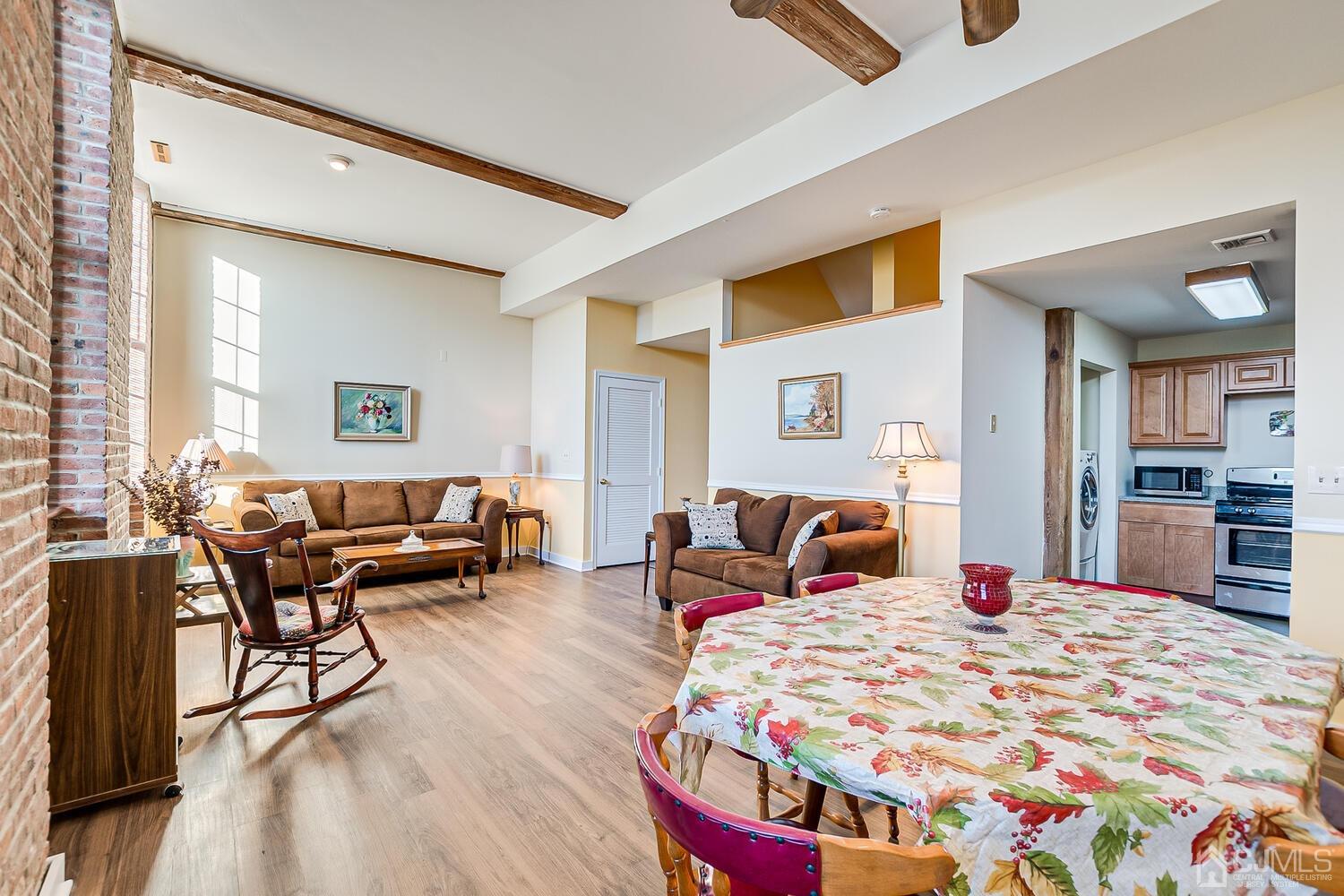 40 Washington Avenue, Unit 9 Milltown, NJ 08850 - Photo 20 of 43 a bedroom with a bed and wooden floor