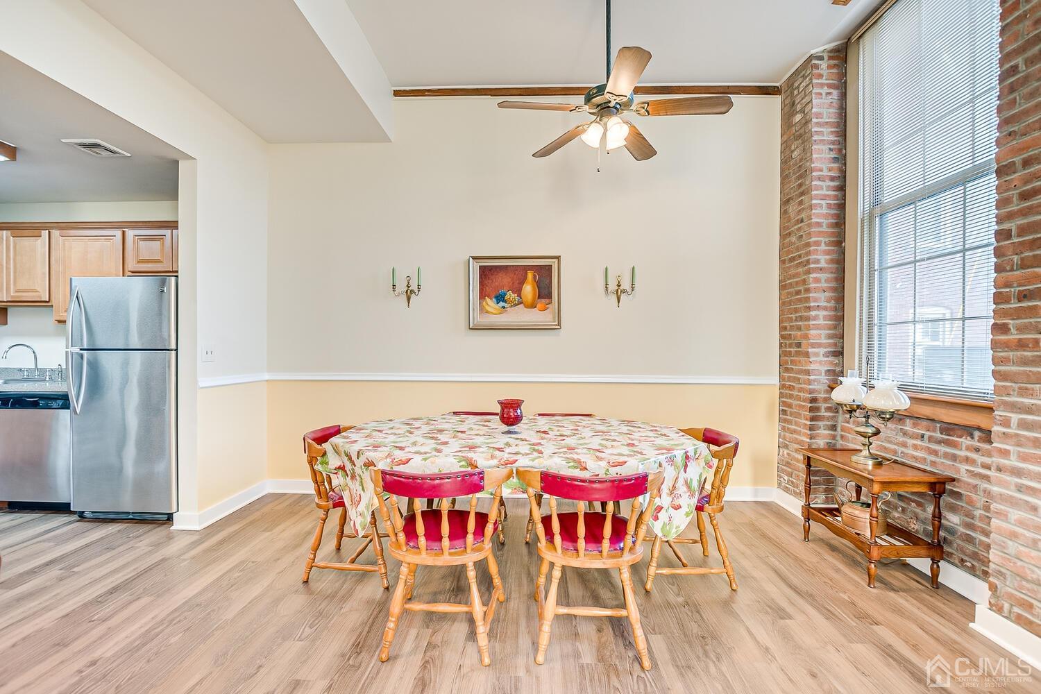 40 Washington Avenue, Unit 9 Milltown, NJ 08850 - Photo 22 of 43 a view of a dining room with furniture and wooden floor