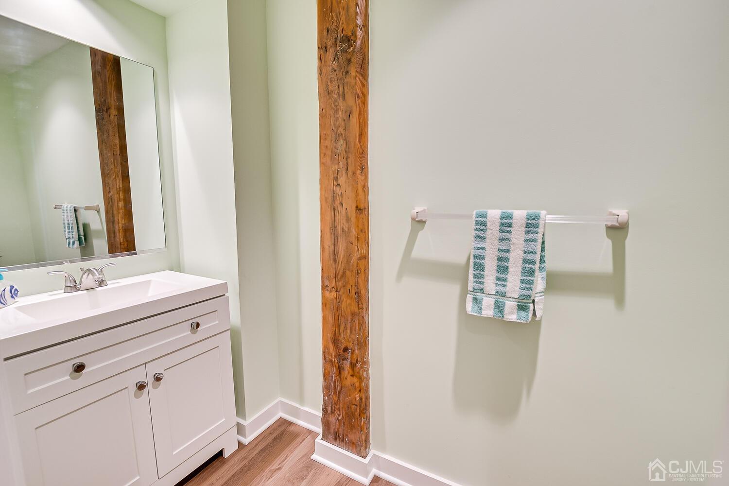 40 Washington Avenue, Unit 9 Milltown, NJ 08850 - Photo 28 of 43 a bathroom with a sink and a mirror
