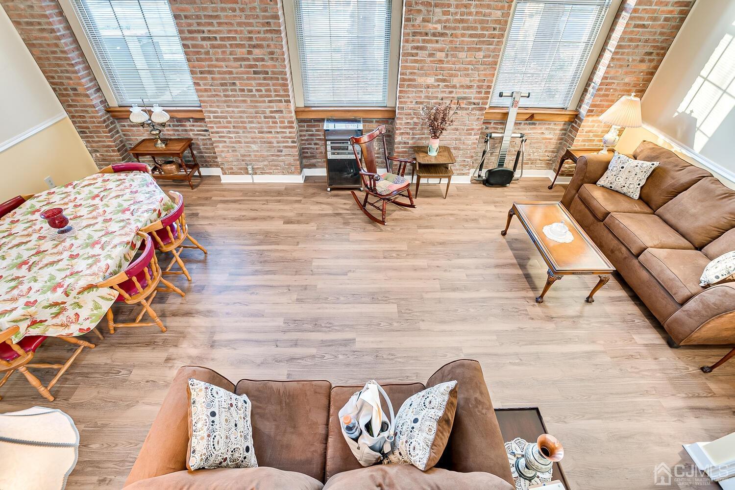 40 Washington Avenue, Unit 9 Milltown, NJ 08850 - Photo 31 of 43 a living room with furniture and a fireplace