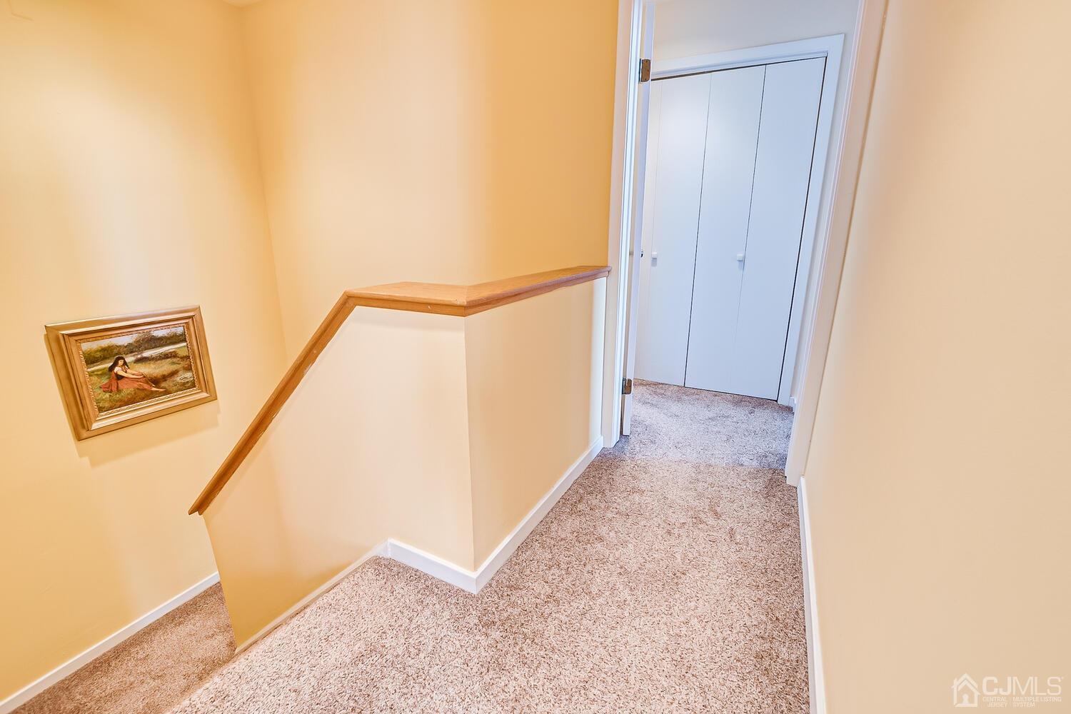 40 Washington Avenue, Unit 9 Milltown, NJ 08850 - Photo 32 of 43 a view of a hallway with staircase