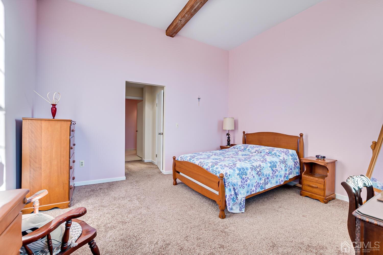 40 Washington Avenue, Unit 9 Milltown, NJ 08850 - Photo 34 of 43 a bedroom with a bed and wooden floor