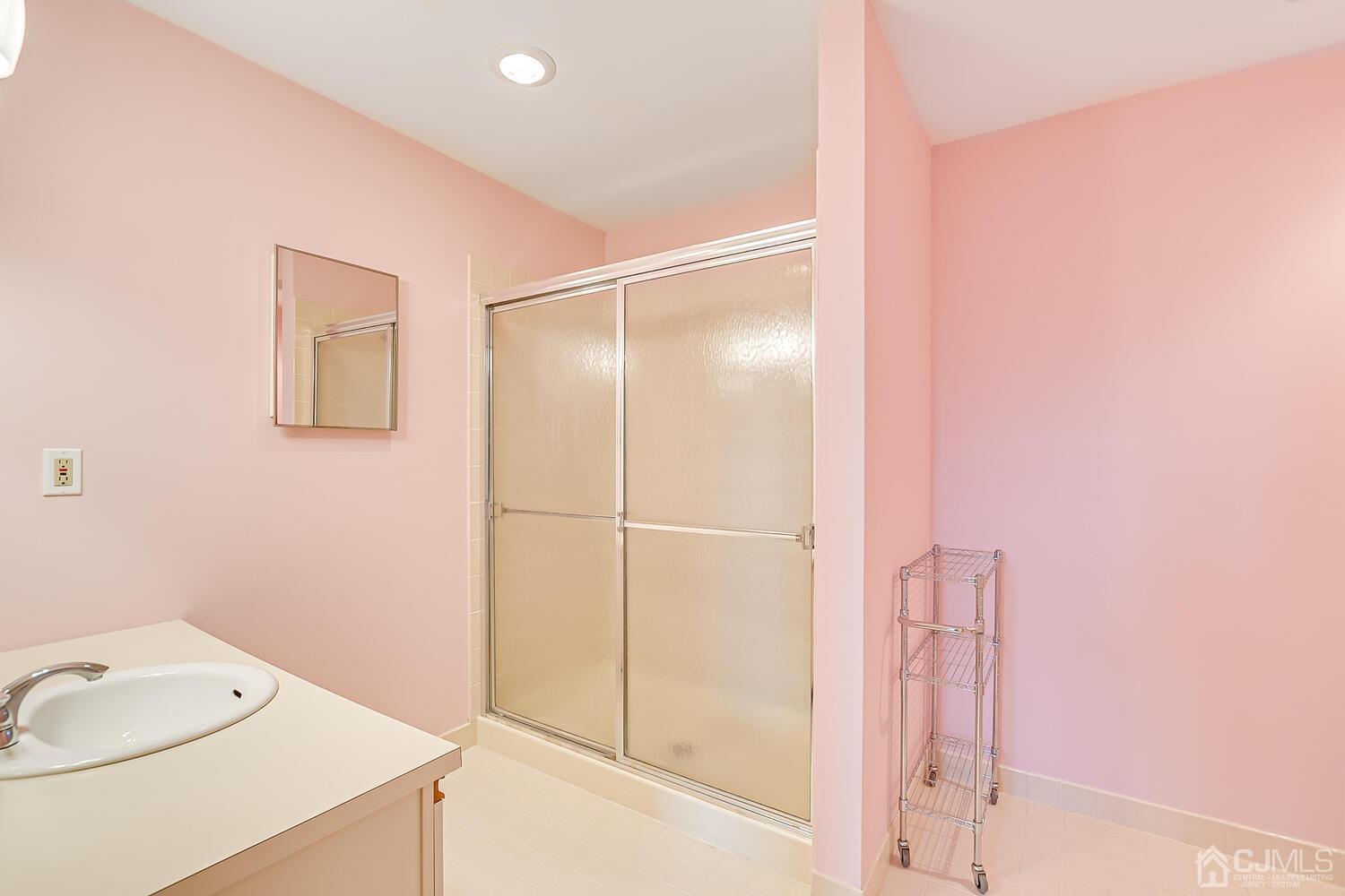 40 Washington Avenue, Unit 9 Milltown, NJ 08850 - Photo 35 of 43 a bathroom with a shower and a sink